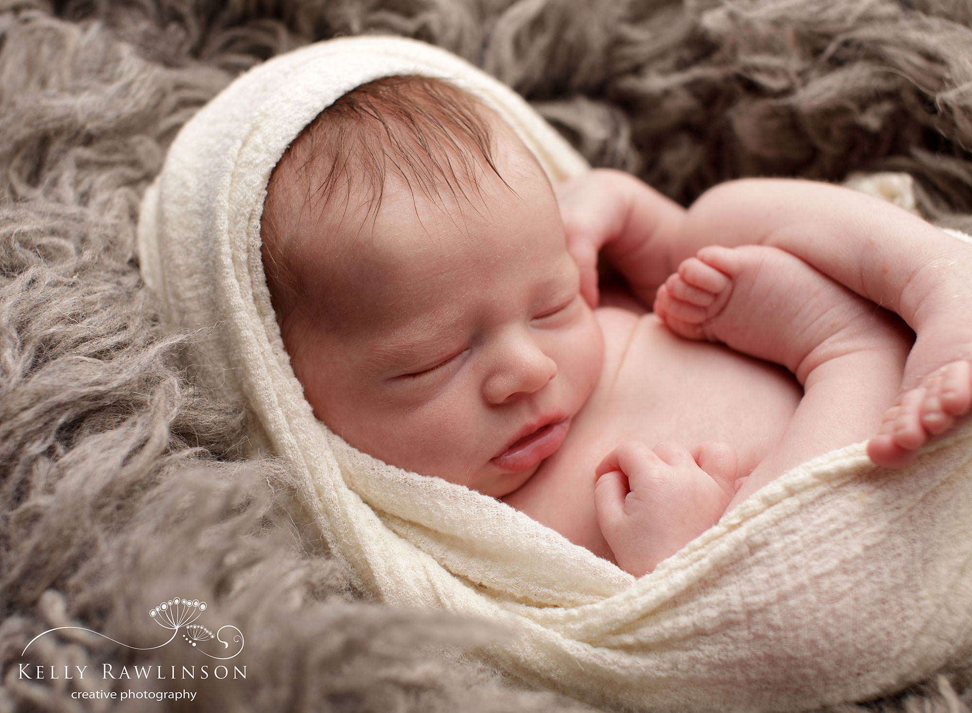 Awesome photo of baby wrapped in swaddle