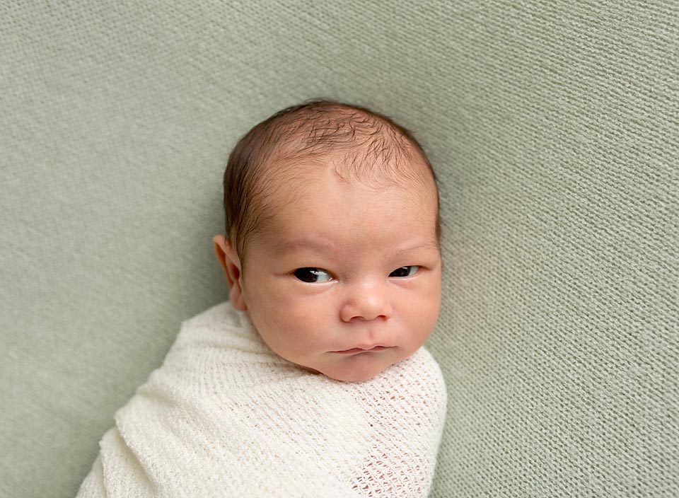 Newborn baby wrapped on Green, Bradford Ontario baby portraits