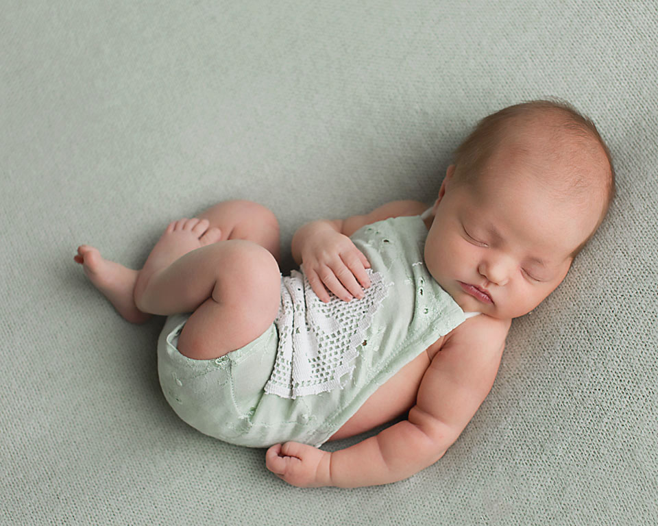 Sweet little baby sleeping soundly for her baby photos at Keswick photo studio