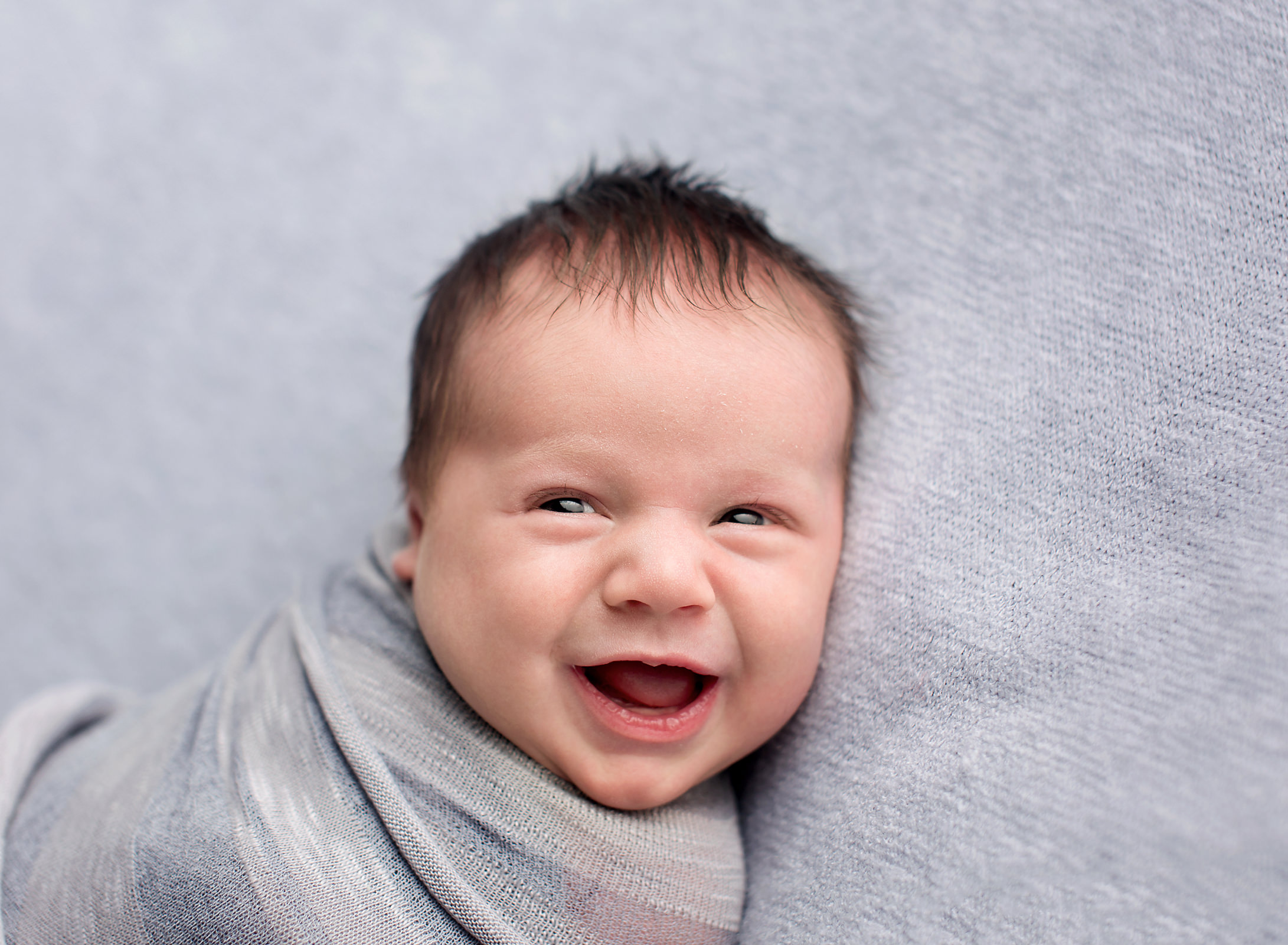 Best baby smiling big at newborn photoshoot